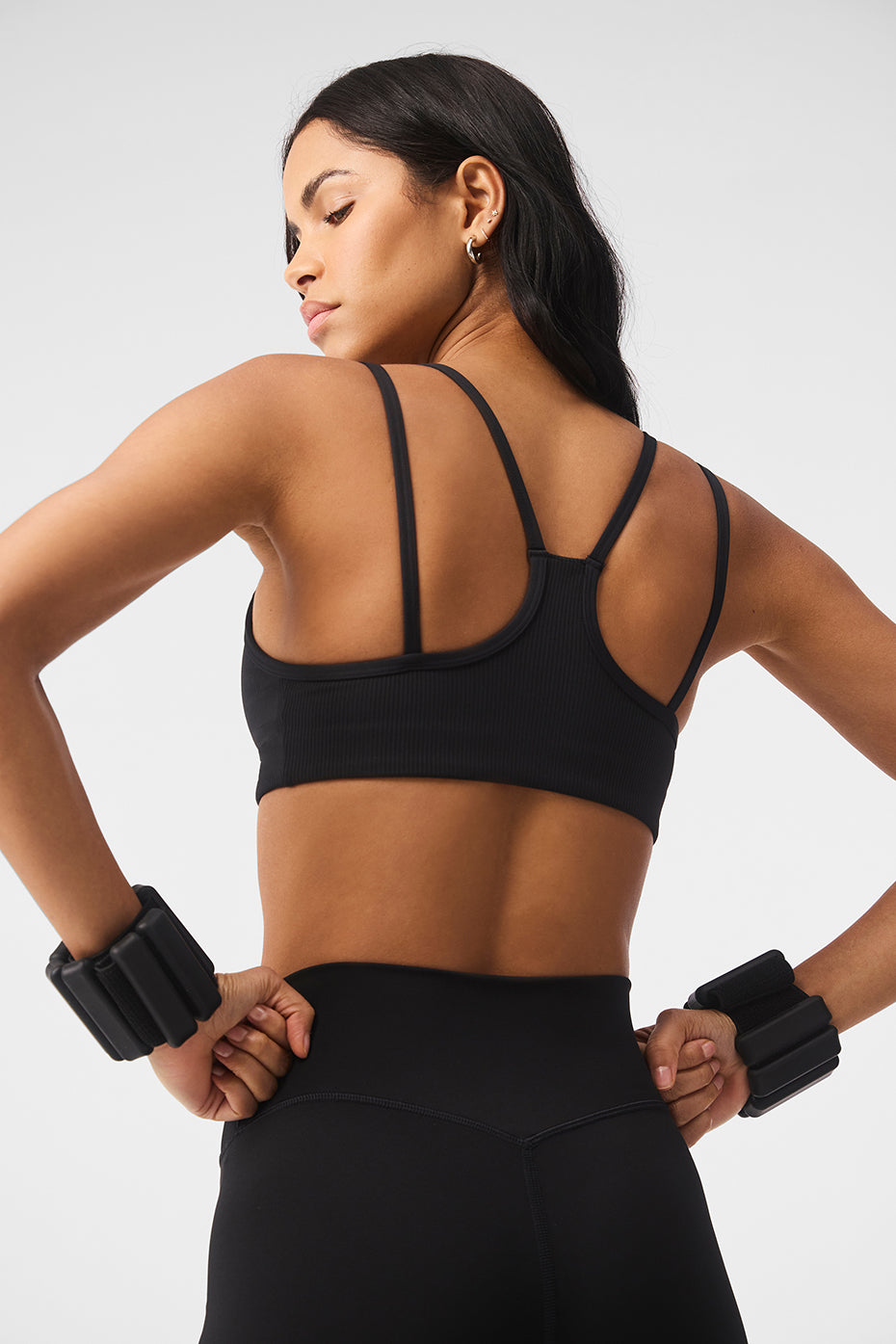 Back view of the ribbed yoga sports bra highlighting its strappy racerback design.