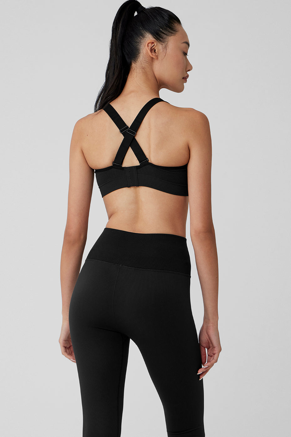Close-up of ribbed texture and hook-and-eye closure on sports bra.