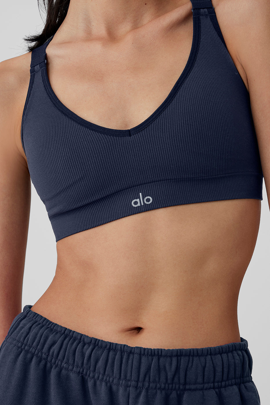 Close-up of the seamless ribbed fabric and hook-and-eye back closure