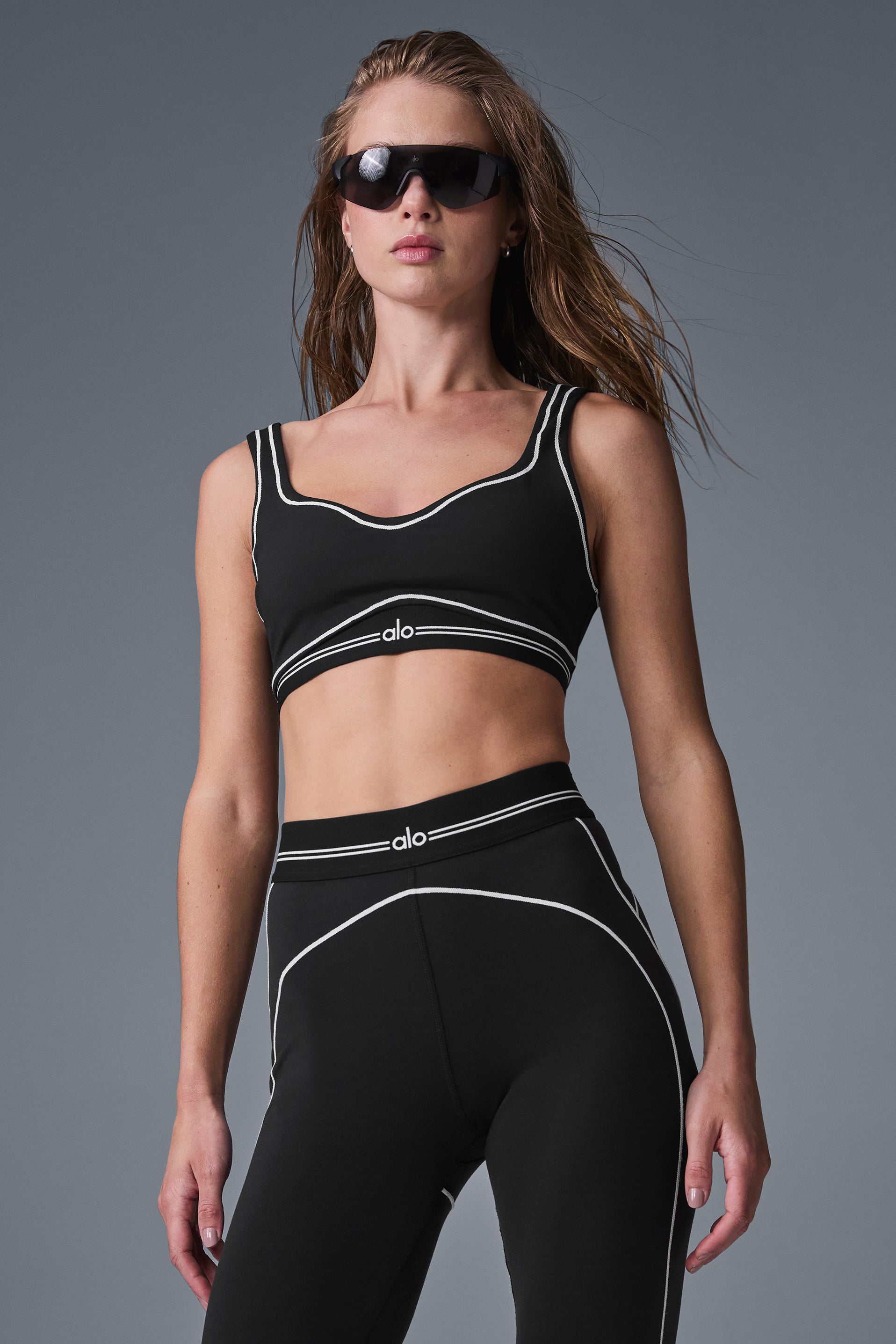 Side view showing the low back design of the Alo Yoga sports bra.