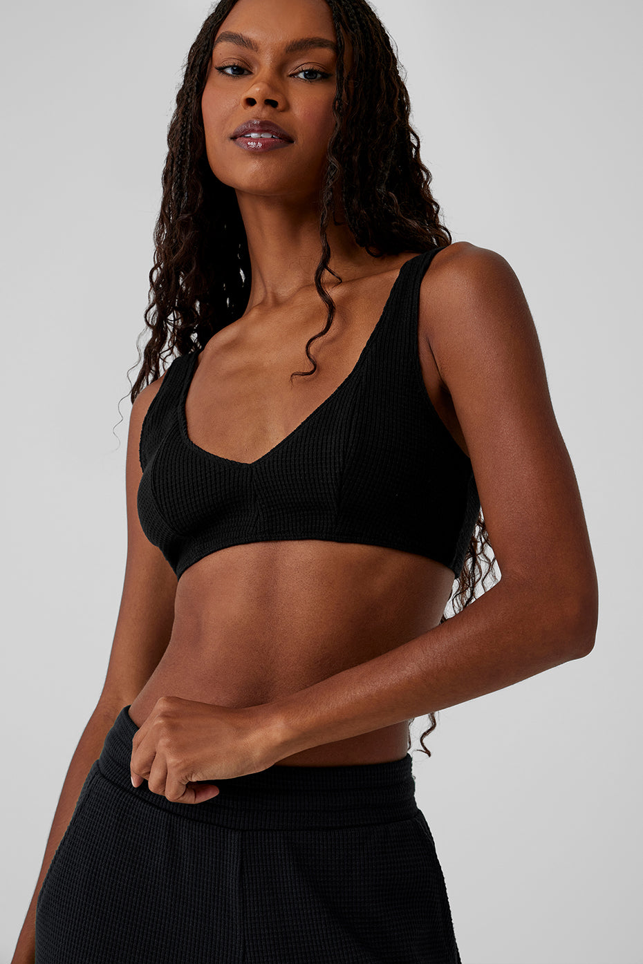 Side angle of the black lounge bra, highlighting the snug underbust band.