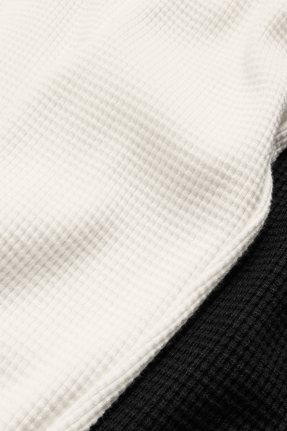 Side angle of the black lounge bra, highlighting the snug underbust band.