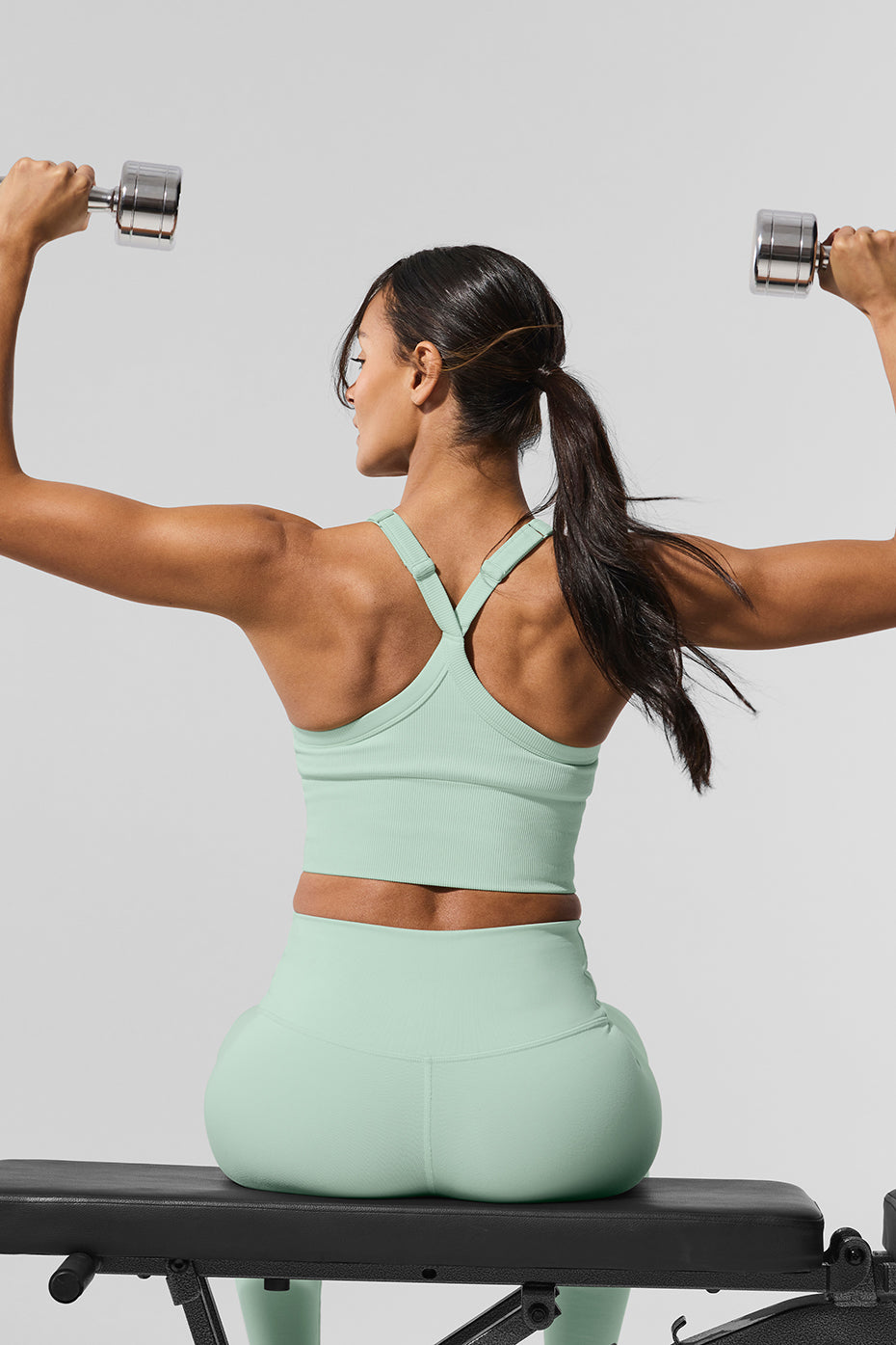 Side view showcasing the adjustable straps of the sports bra tank.