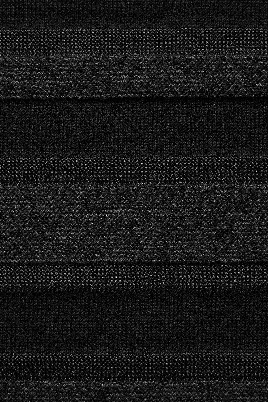 Side angle of sports bra emphasizing snug fit and rib-grazing length.