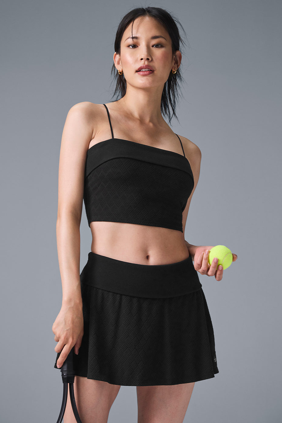 Front view of the Doubles Only sports bra tank top in black, showcasing the ribbed texture.