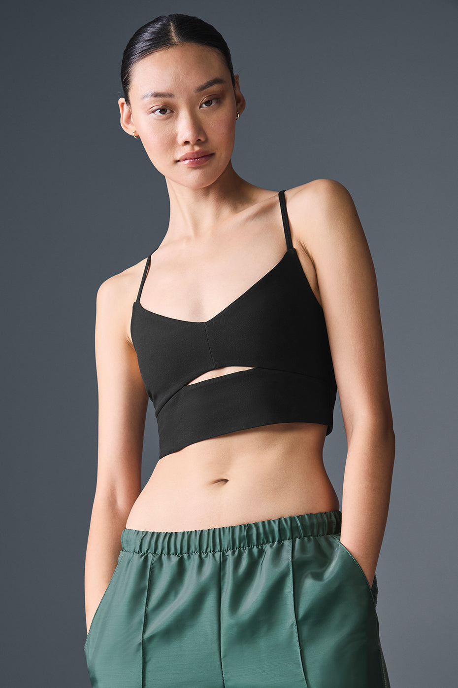 Side view of the black Alosoft Highlight Sports Bra showing keyhole detail