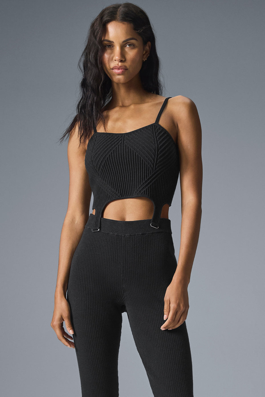 Black denim knit tank top laid flat, showcasing its textured fabric