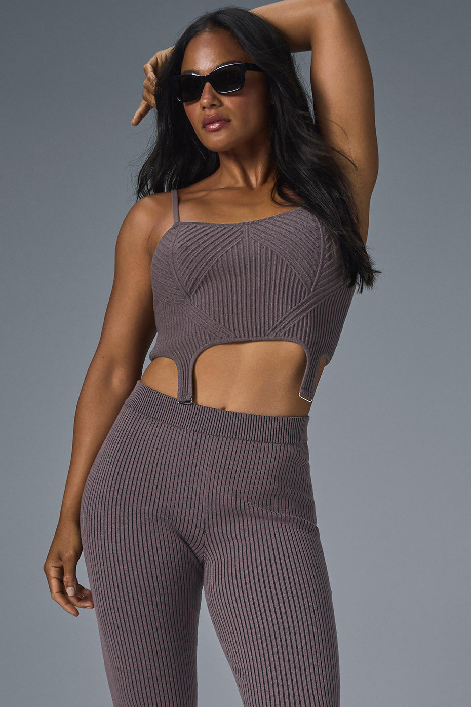 Front view of the chic denim knit garter strap top, showcasing its texture and fit.