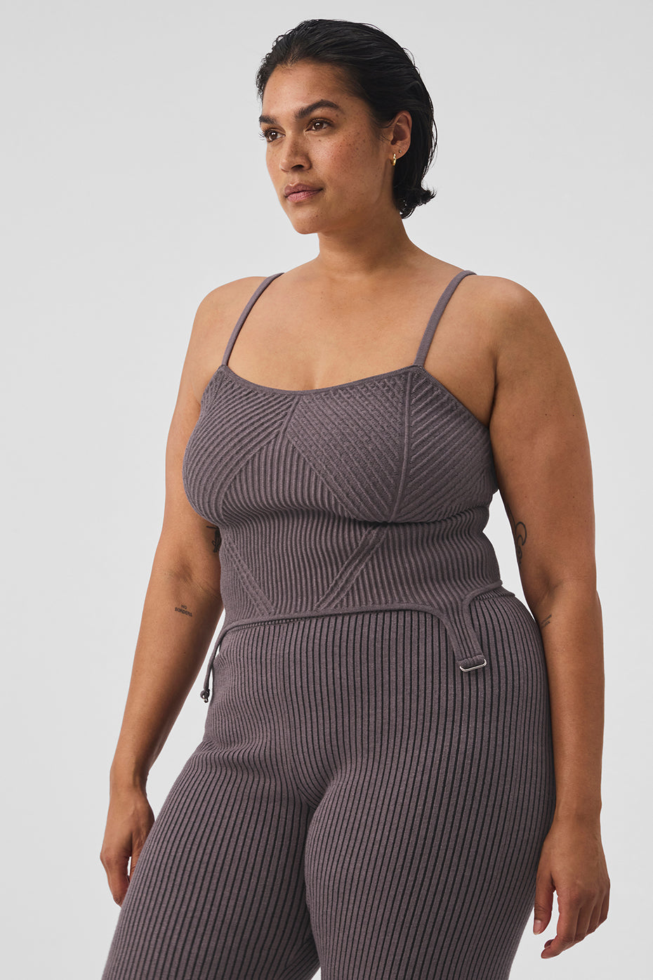 Front view of the chic denim knit garter strap top, showcasing its texture and fit.