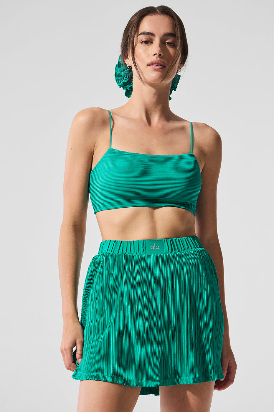 Side view of Micro Plisse Sports Bra showcasing its pleated design.