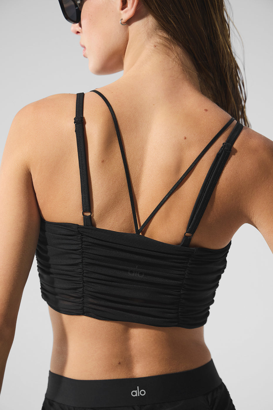 Front view of the Airlift Mesh Yoga Bra in black, showcasing its stylish design.