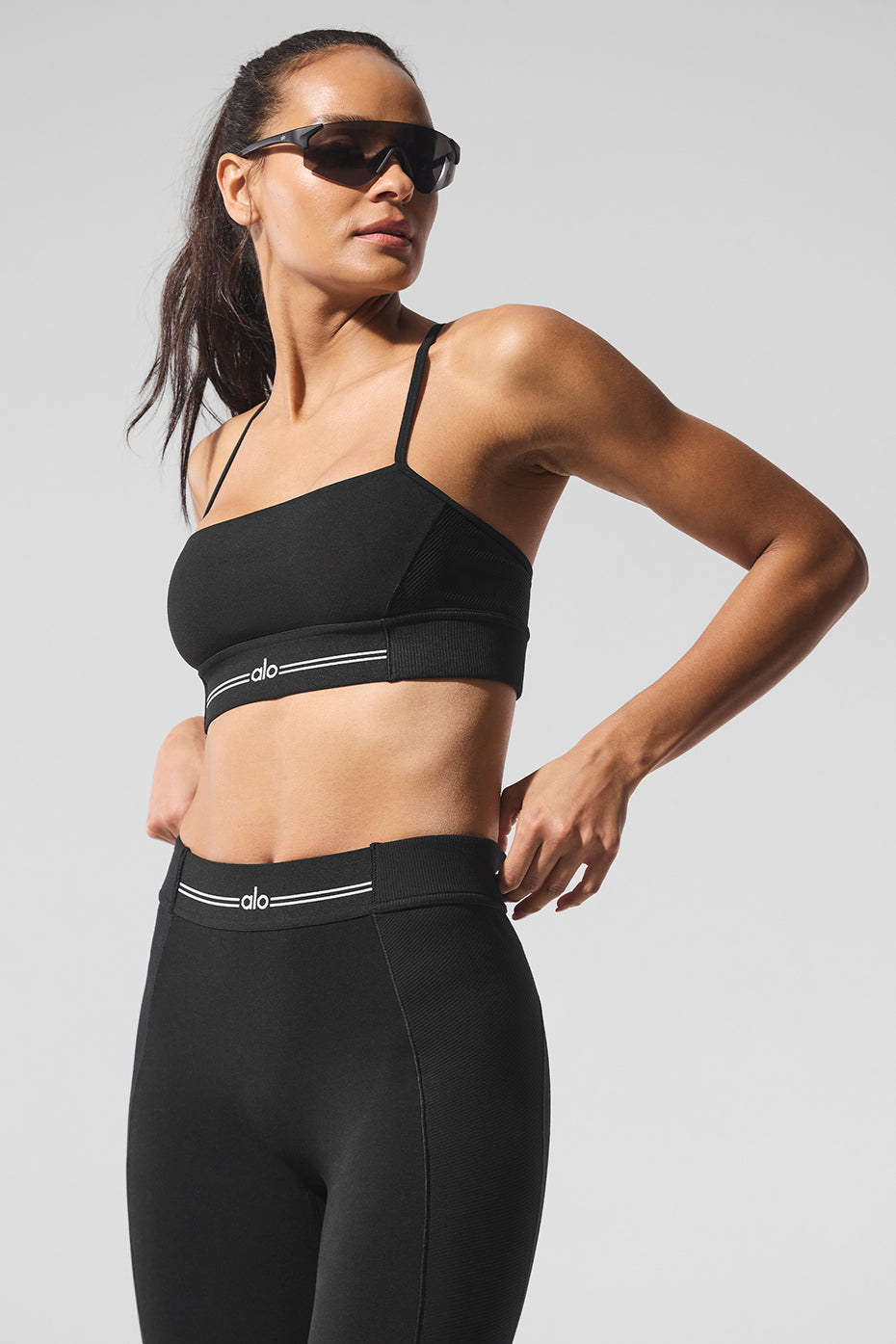 Front view of the butter soft sports bra in black and white, highlighting its ribbed design.