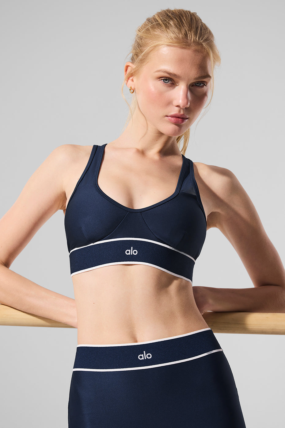 Back view showing sheer mesh bras with open-back design