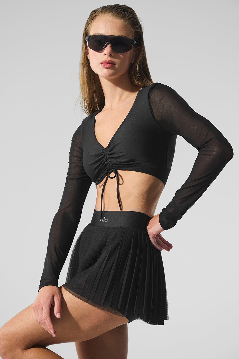 Side angle of the black Airlift Luxe Mesh Long Sleeve Bra during a workout.