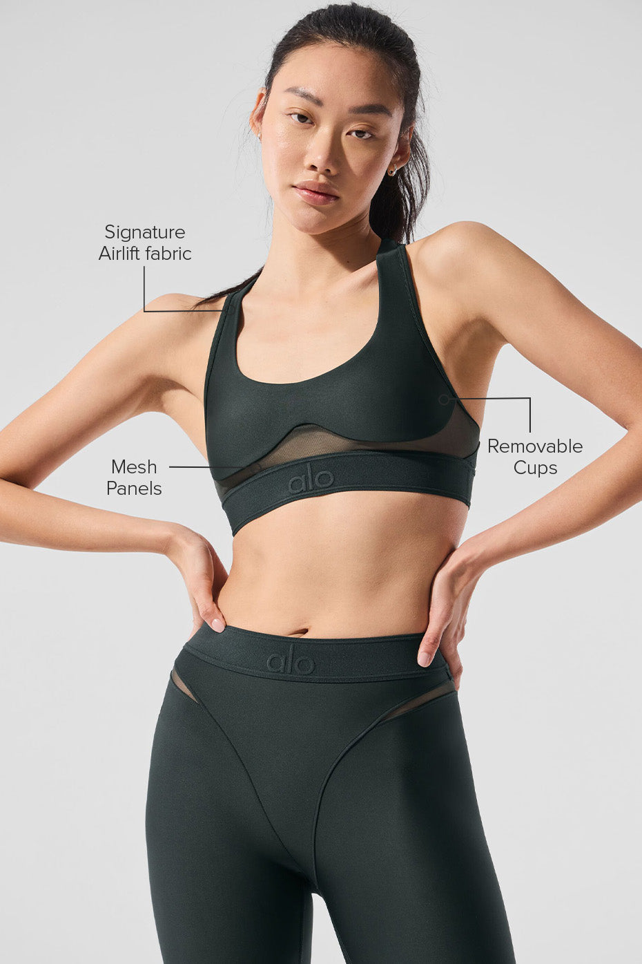 Charcoal Green Airlift Rebel Bra worn during a yoga session.