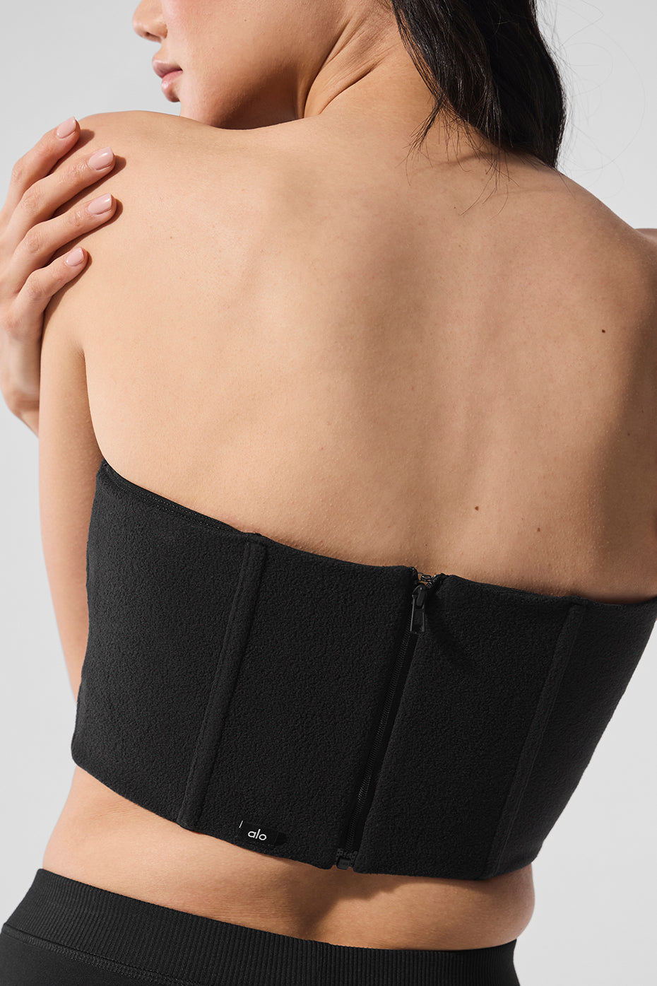 Flat lay of black corset dress with accessories, ready for girls brunch styling