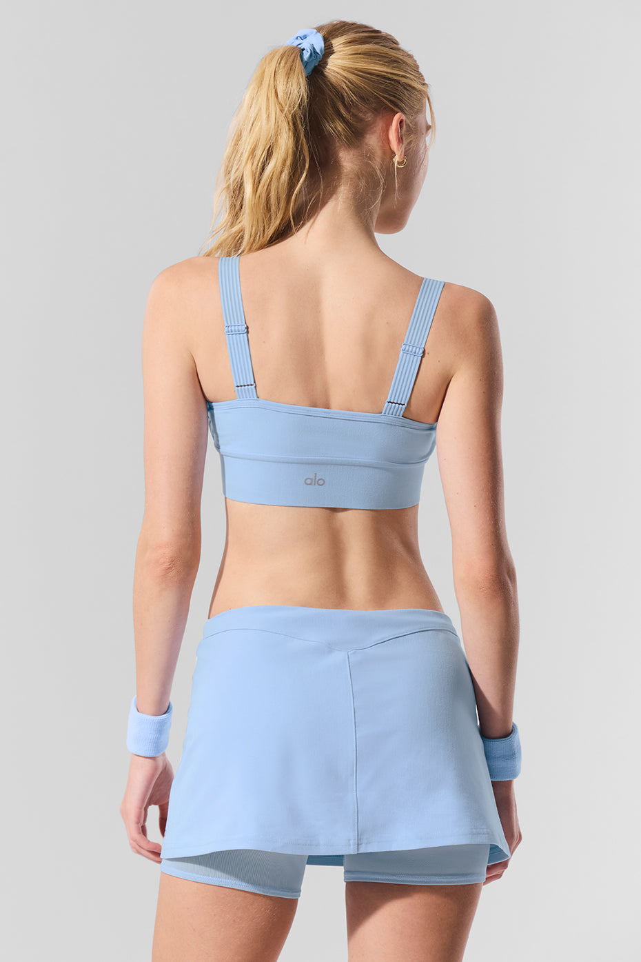 Side angle of the Alosoft yoga sports bra with mesh details for breathability.