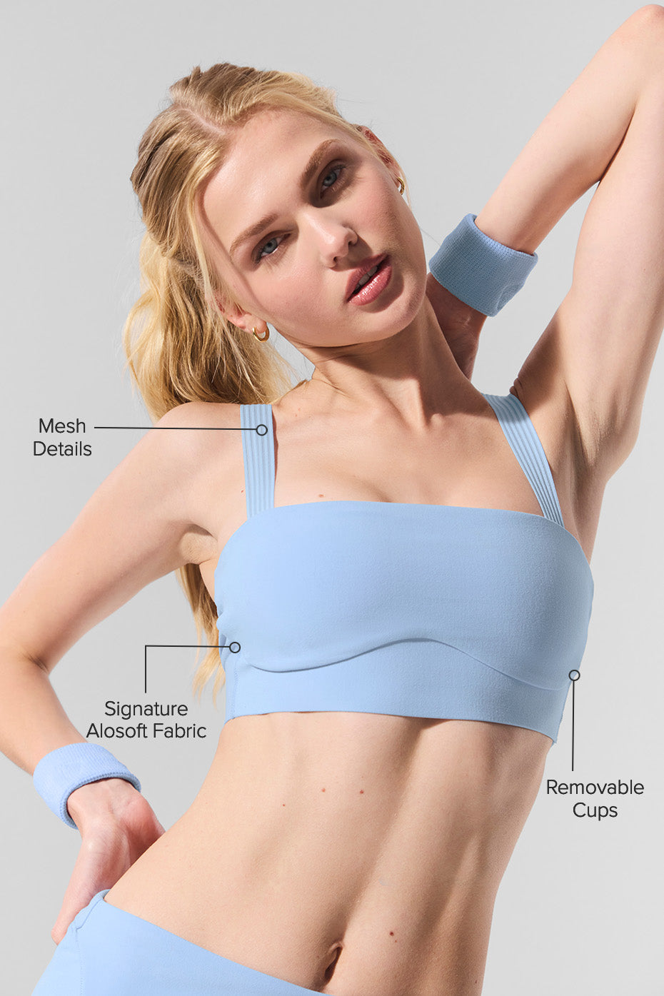 Side angle of the Alosoft yoga sports bra with mesh details for breathability.