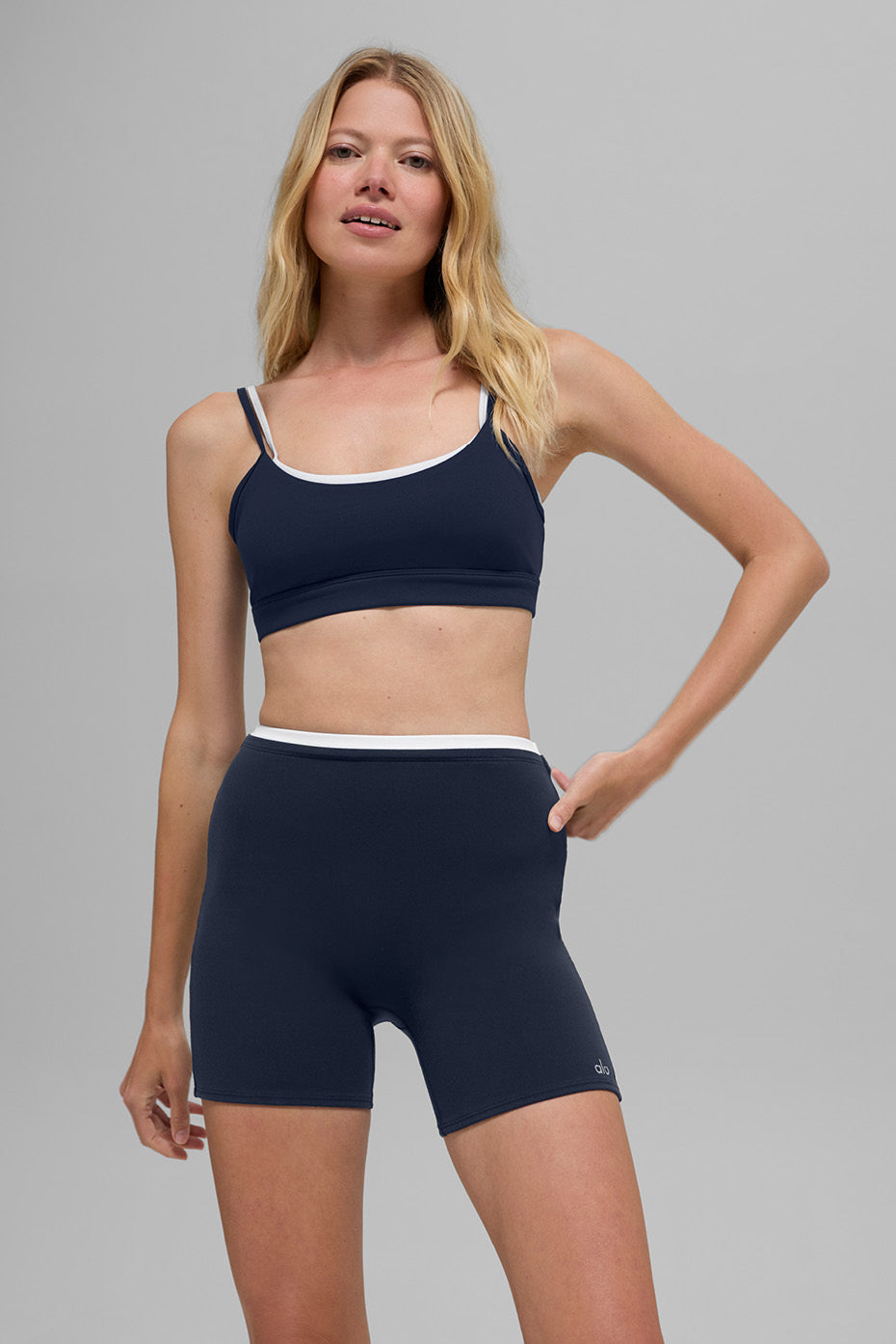 Front view of navy and white high impact sports bra, designed for movement