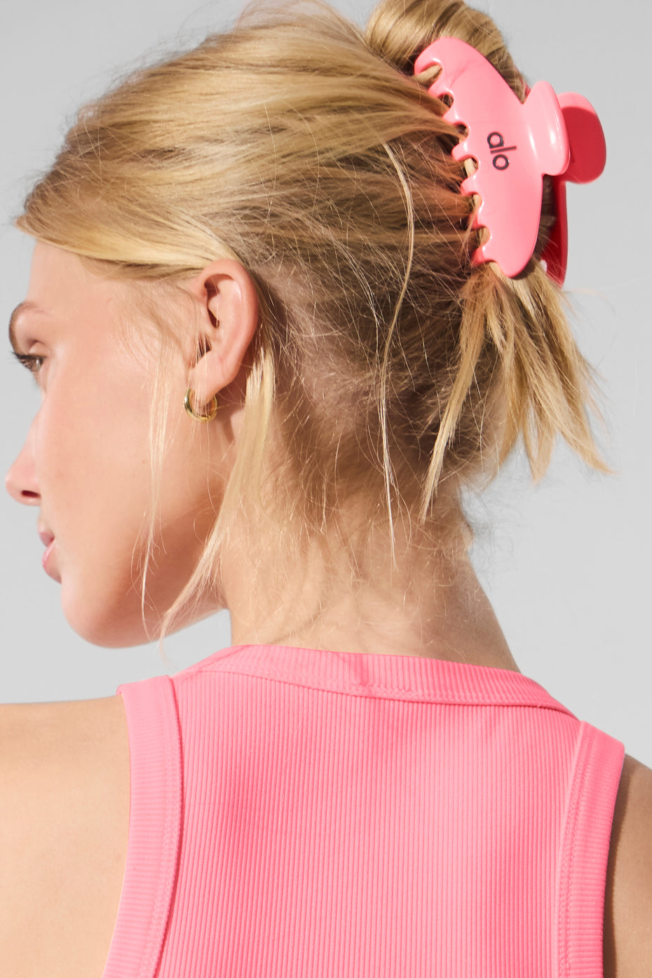 Styled bridal updo using neon claw clip as a playful bride to be hair accessory