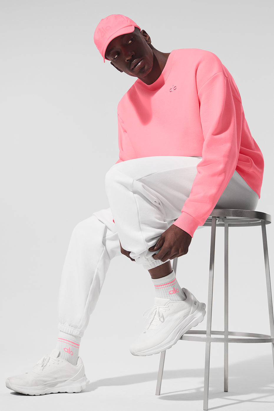 Flat lay of retro crew socks in white and neon bubblegum, perfect for casual outfits.