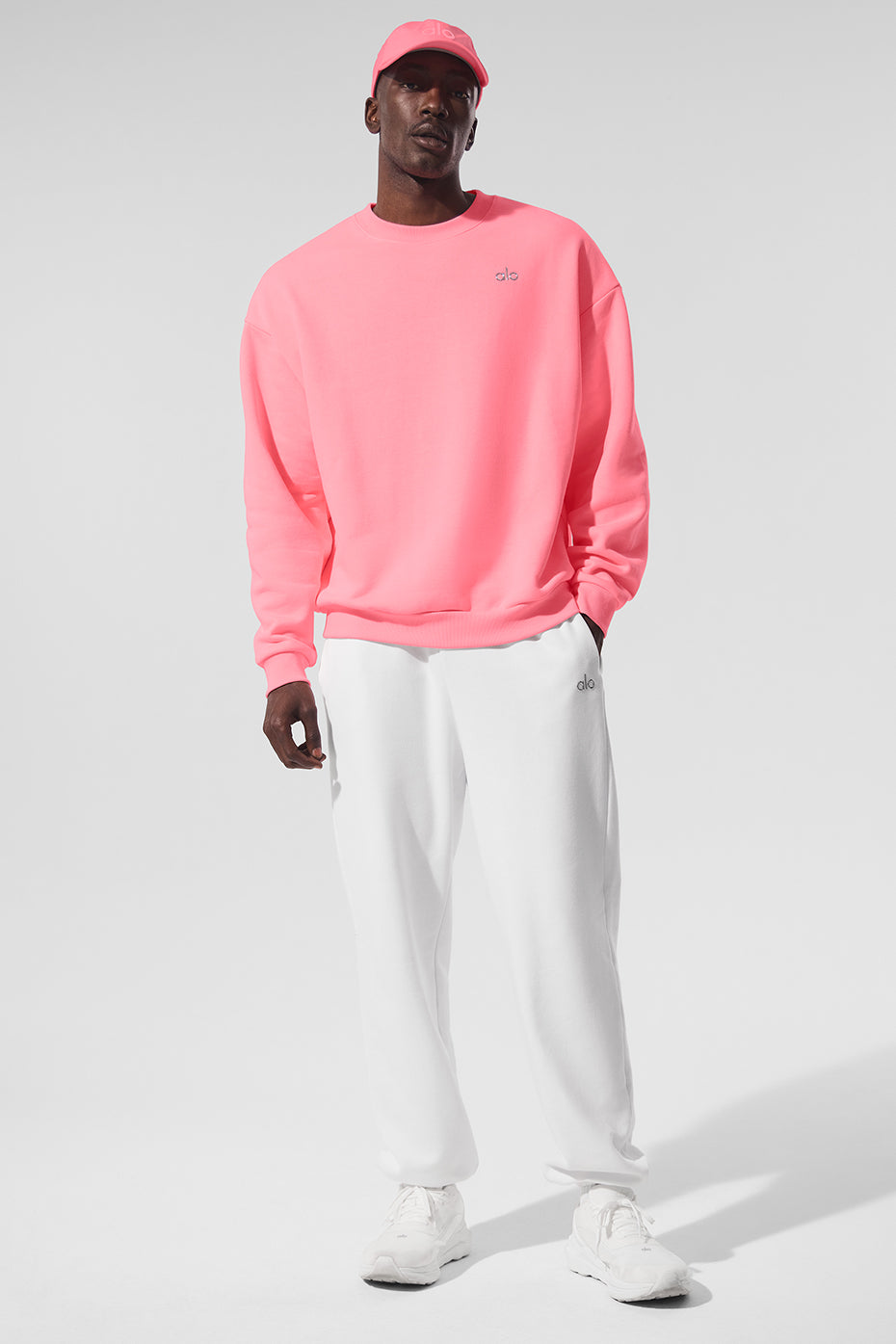 Model wearing the French terry pullover with relaxed fit and dropped shoulders in casual street setting