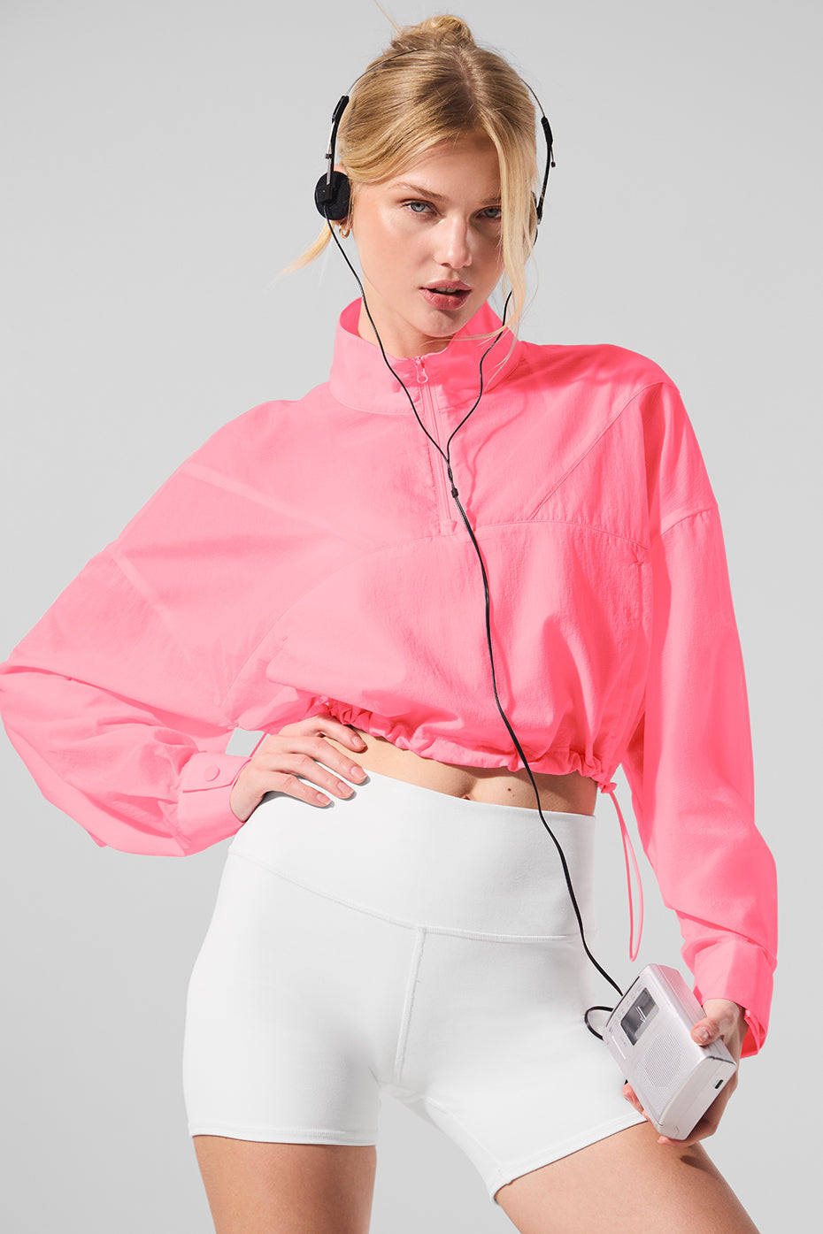 Back view of the cropped turtleneck pullover highlighting the airy cutouts.