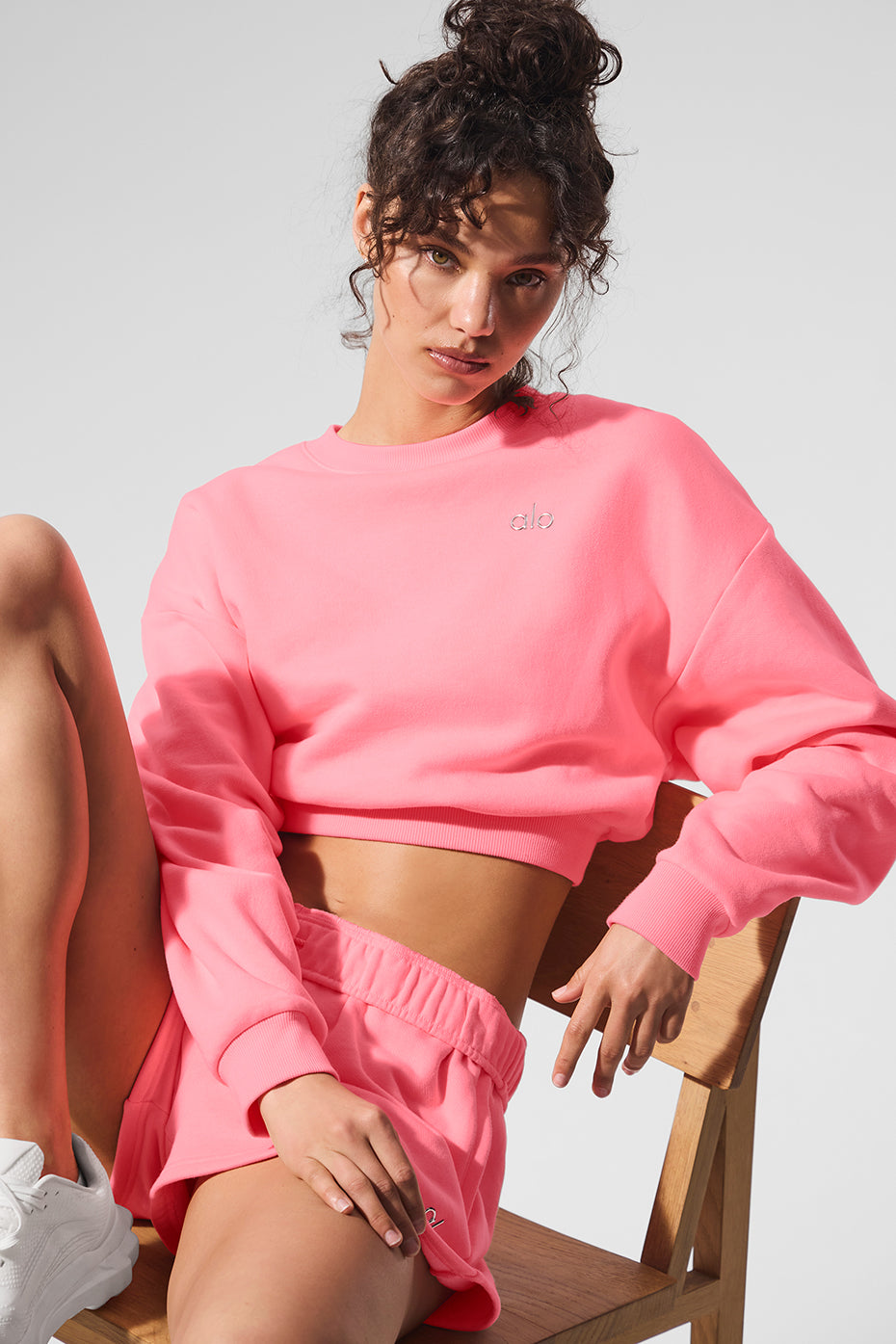 Front view of the neon green crewneck sweatshirt, styled for casual wear.