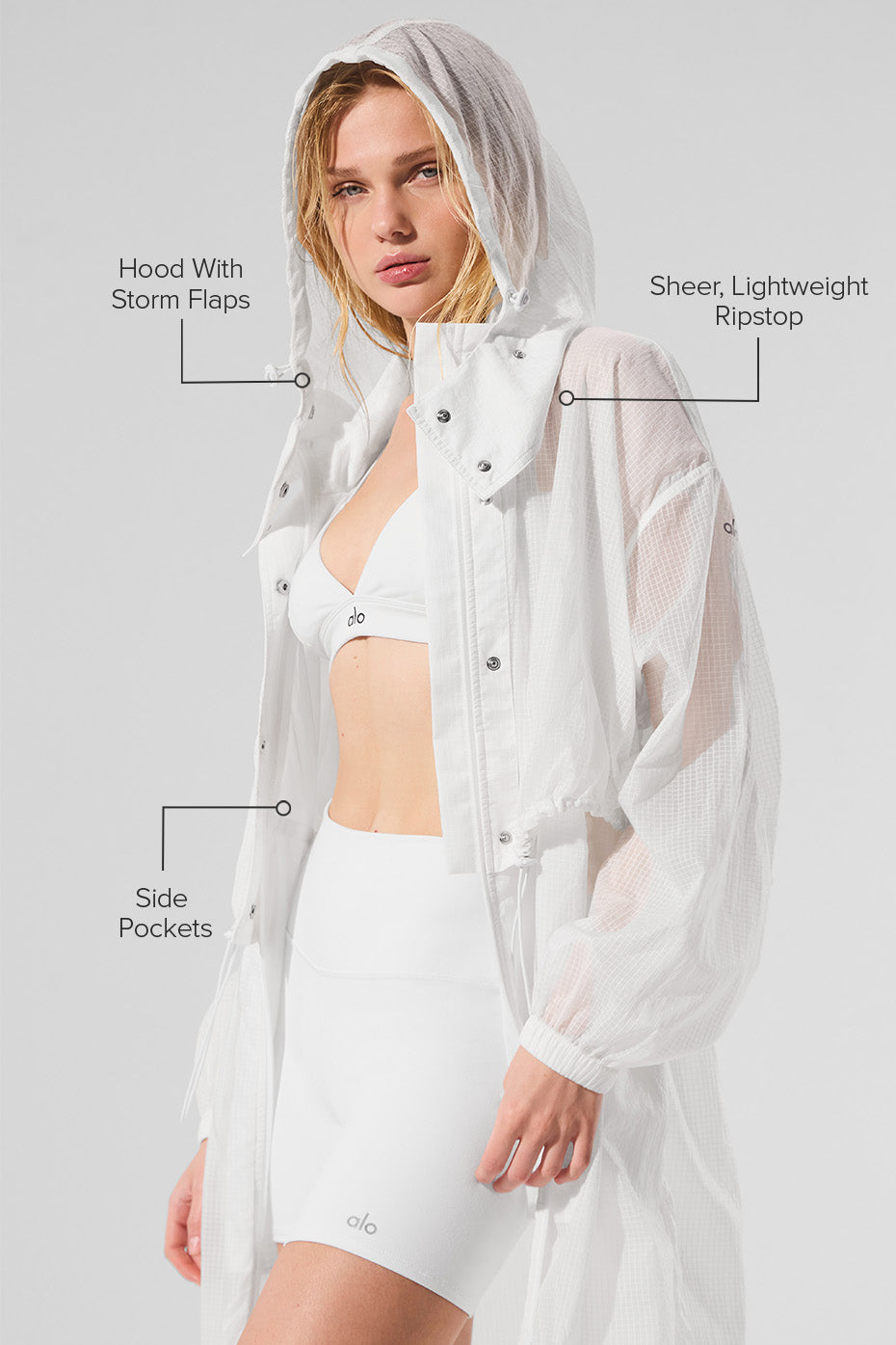 Plus size womens trench coat styled with scarf in autumn setting