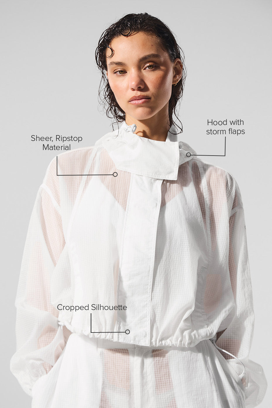 Model tying up the breathable cropped jacket after workout