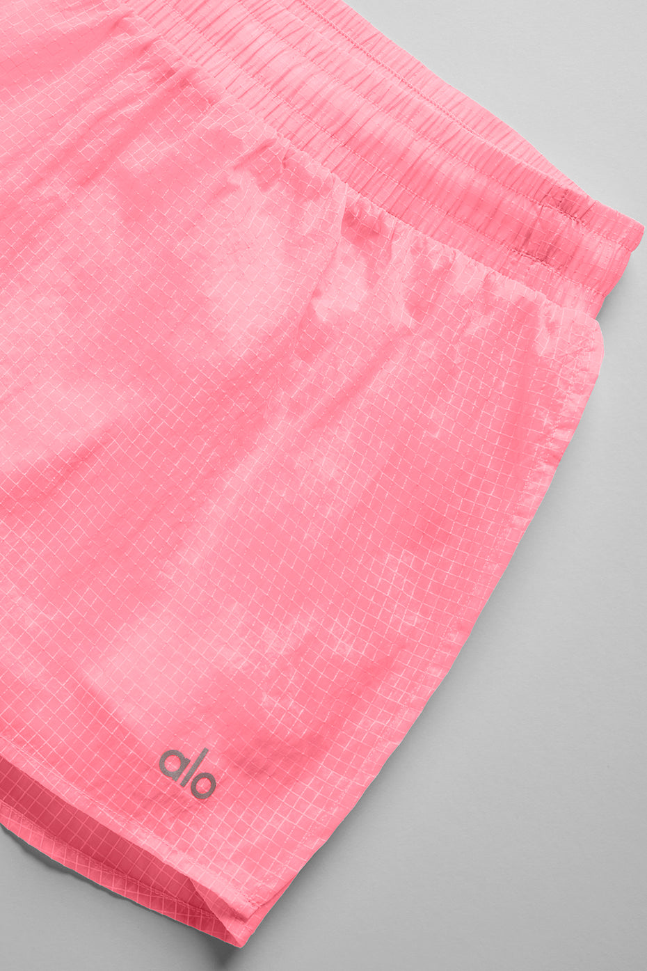 Side angle showing built-in liner and breathable fabric of sports shorts