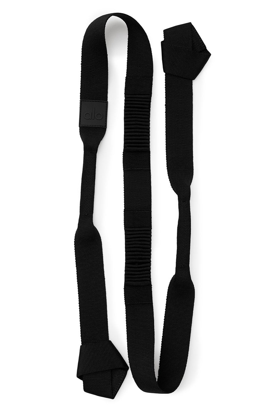 Close-up of the black yoga mat carrier with adjustable looped ends.