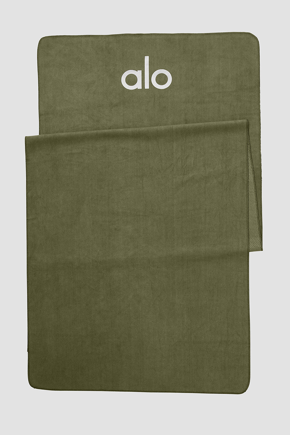 Grounded No-Slip Towel with jungle design on a yoga mat during hot yoga session