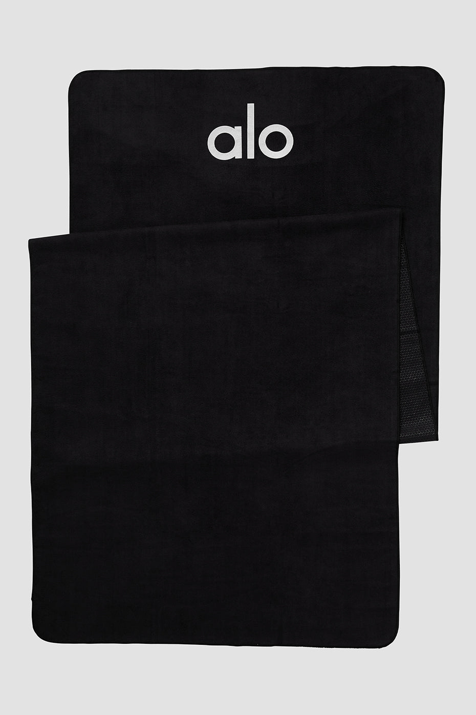Close-up of the Grounded non-slip yoga towel showing silicone grip pattern.
