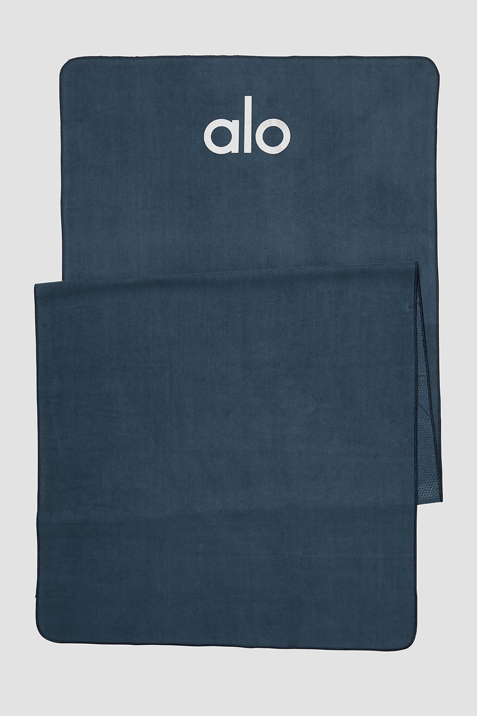 Eclipse non-slip yoga towel showcasing its grip pattern on a yoga mat.