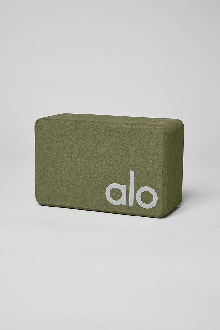 Close-up of the Elevate Your Practice Yoga Block, highlighting its firmness and grip.