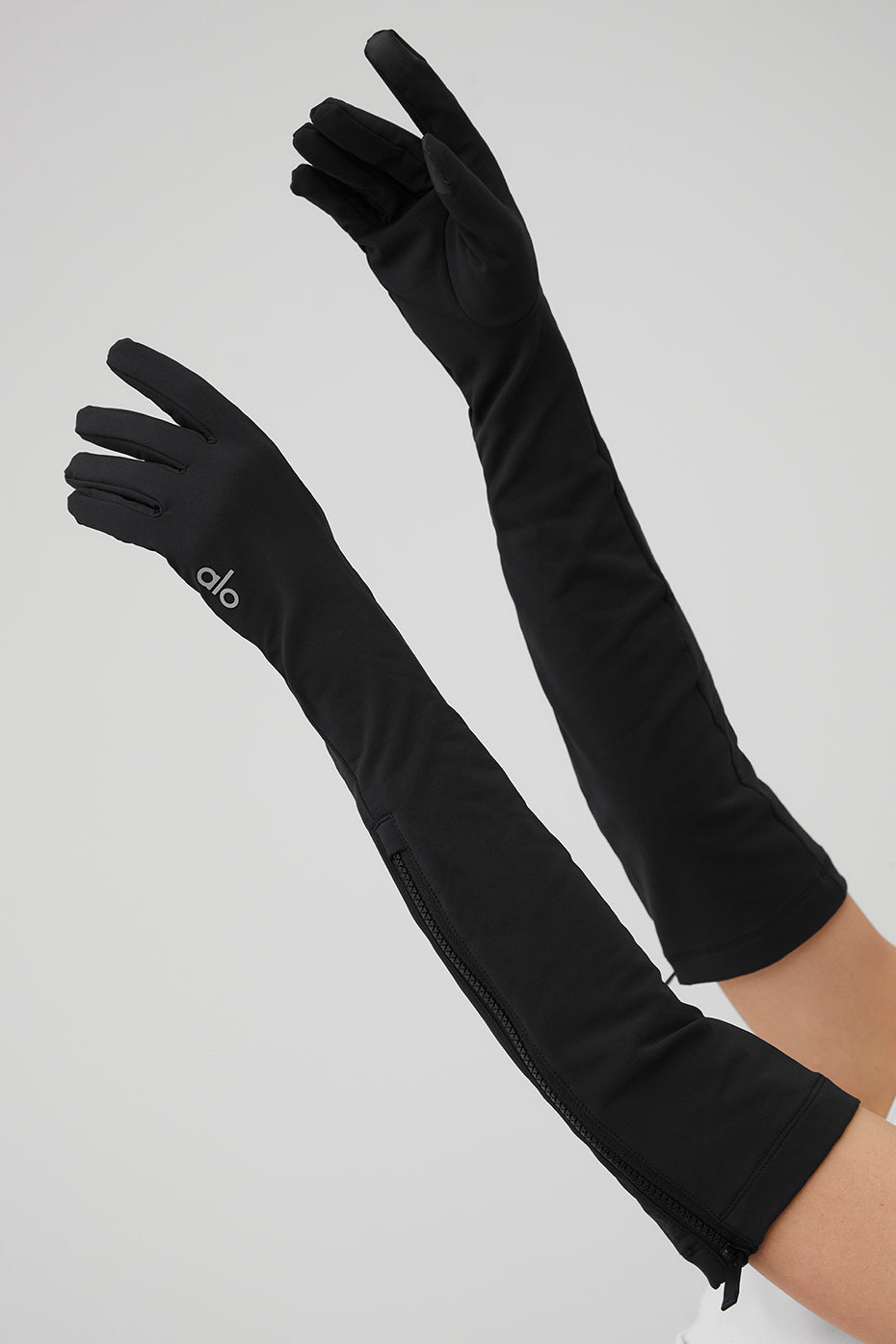 Urban setting featuring black gloves suitable for cold weather.