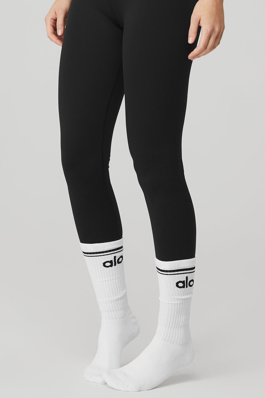 Model wearing Classic Throwback Barre Grip Socks during a barre class.