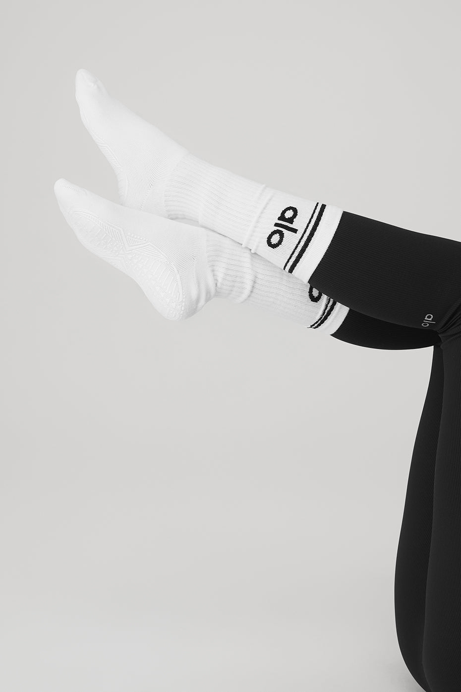 Front view of Classic Throwback Barre Grip Socks on a yoga mat.