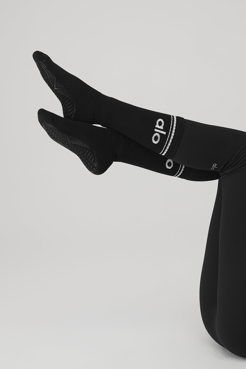 Close-up of classic black and white barre socks showing soft texture.