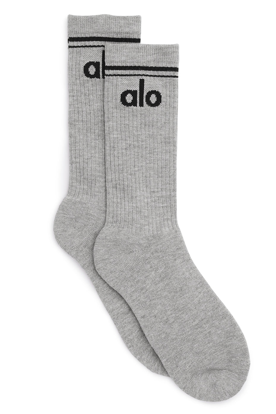 Side profile of unisex throwback socks styled with sneakers outdoors