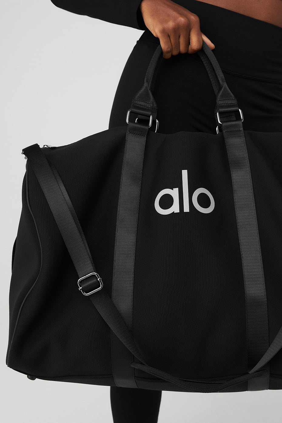 Interior of the weekender bag showing spacious compartments and pockets.