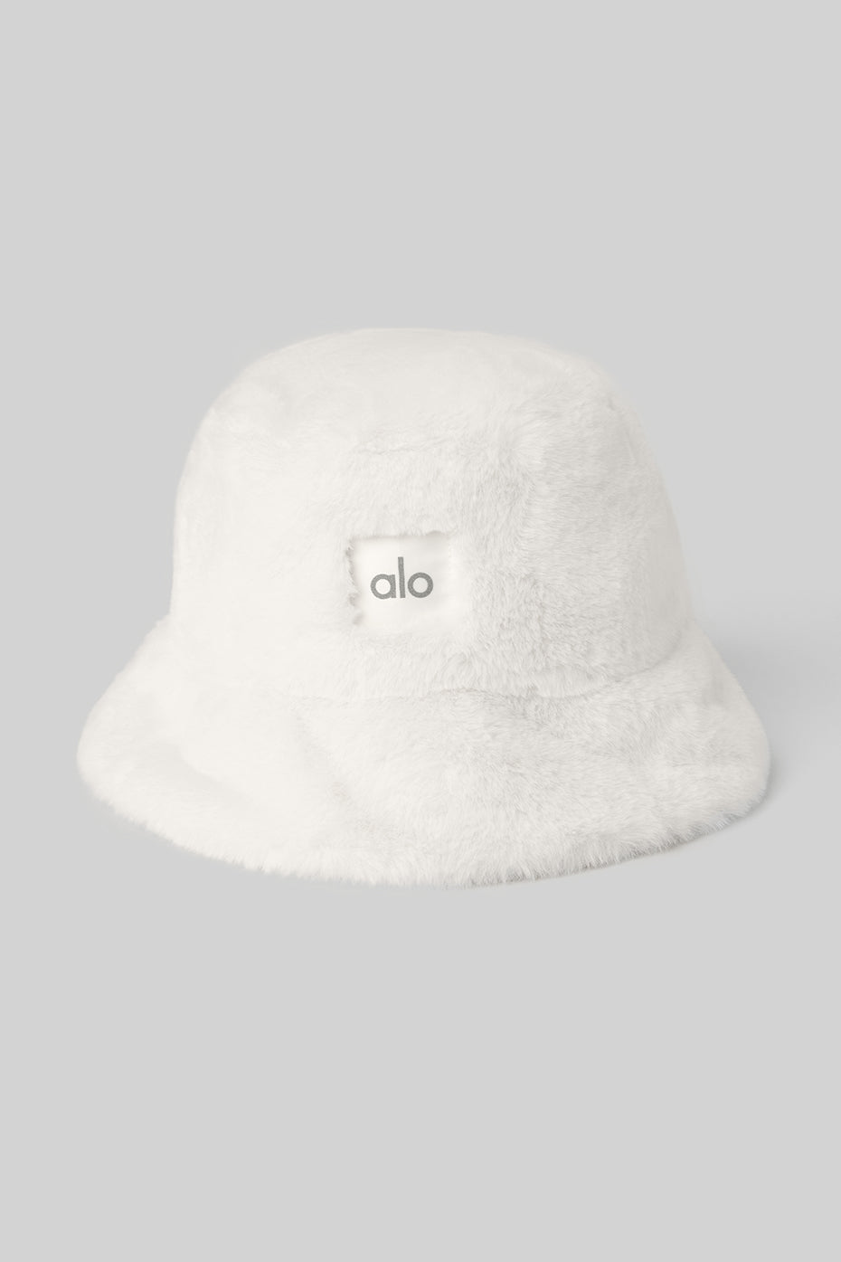 Close-up of ivory faux fur bucket hat texture