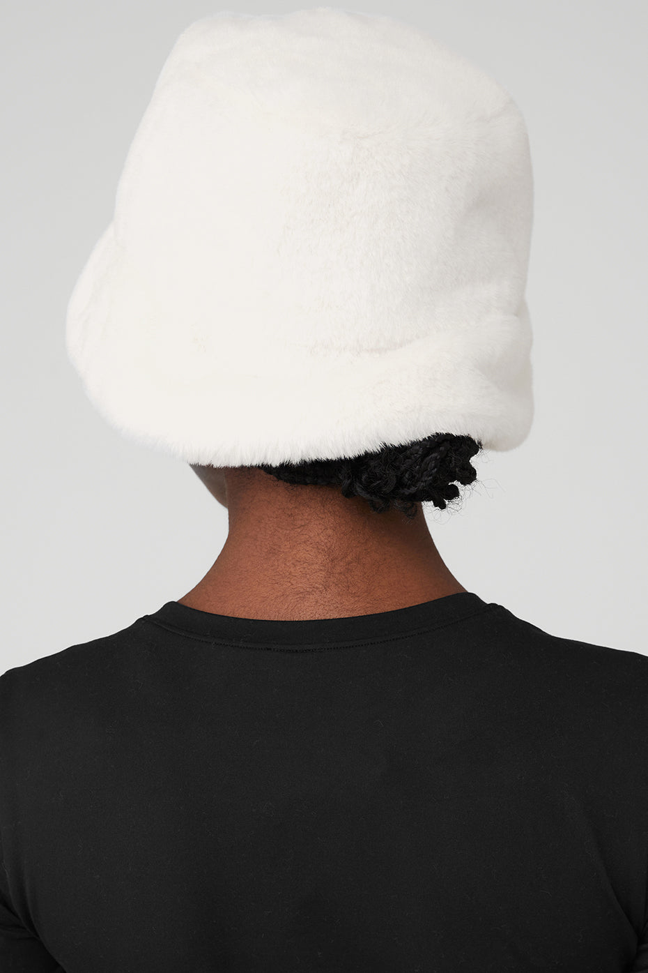 Close-up of ivory faux fur bucket hat texture