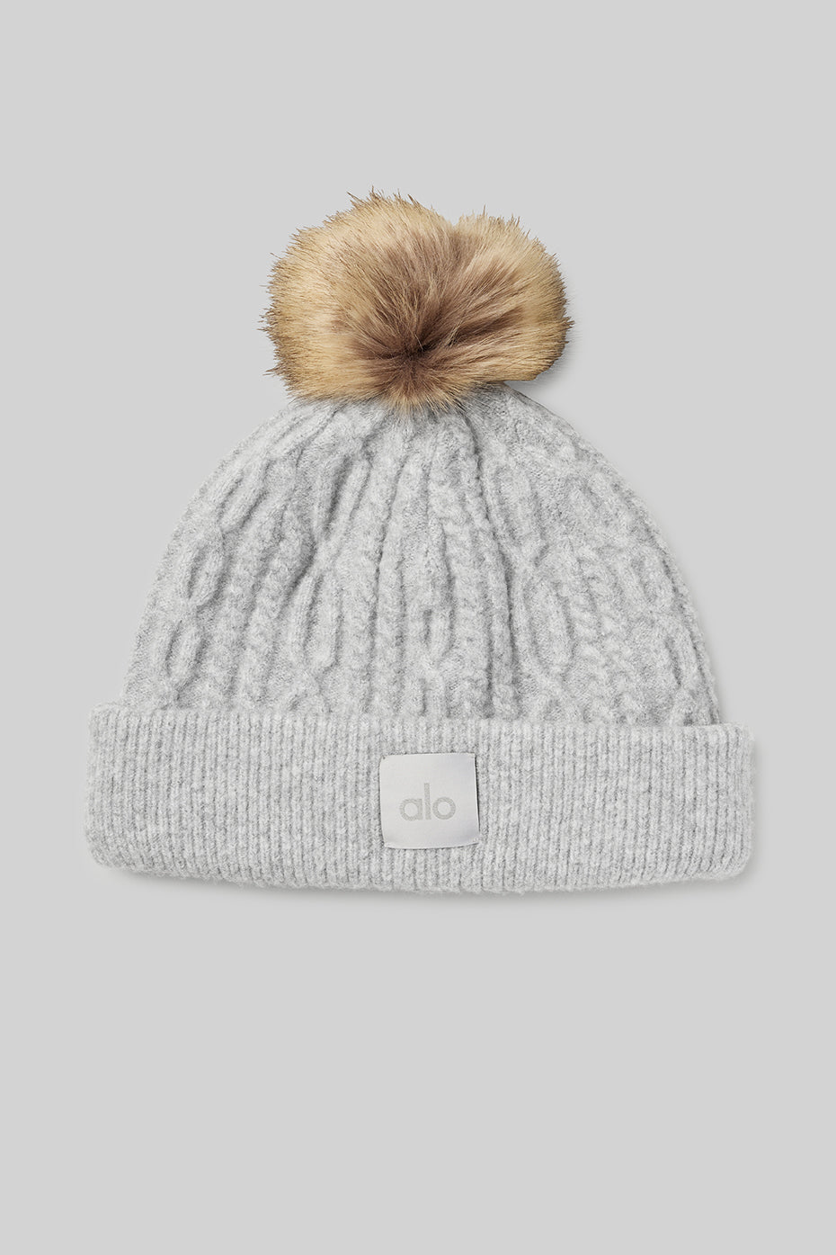 Close-up of cozy cable knit beanie in heather grey