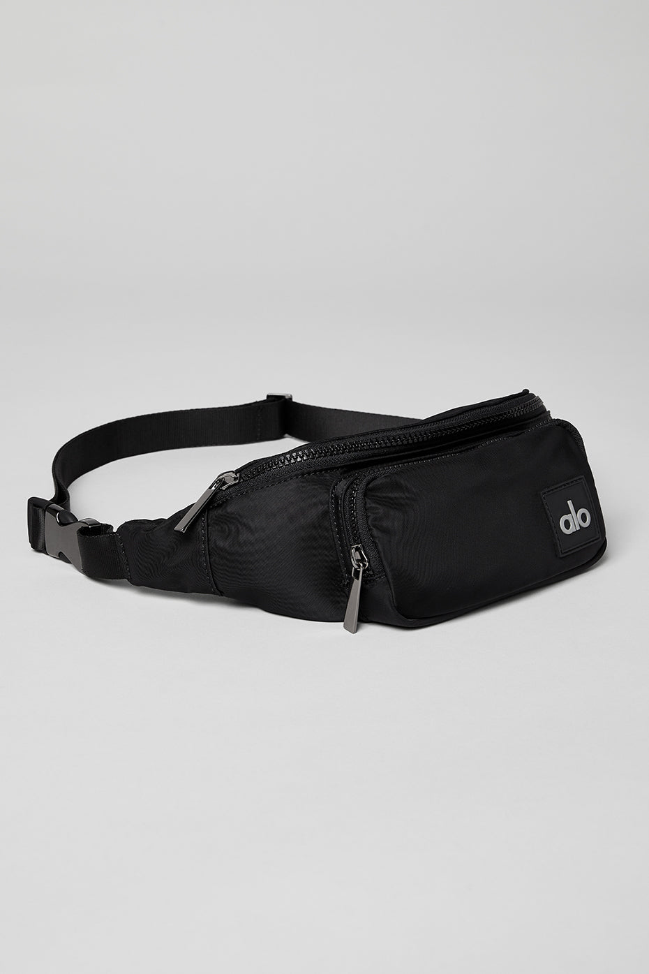 Close-up of the adjustable strap and gunmetal hardware on the Explorer leather belt bag.