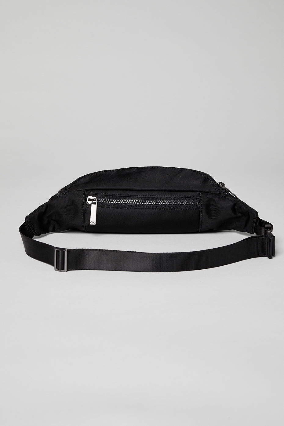 Front view of the Explorer leather belt bag in black, featuring zip pockets.