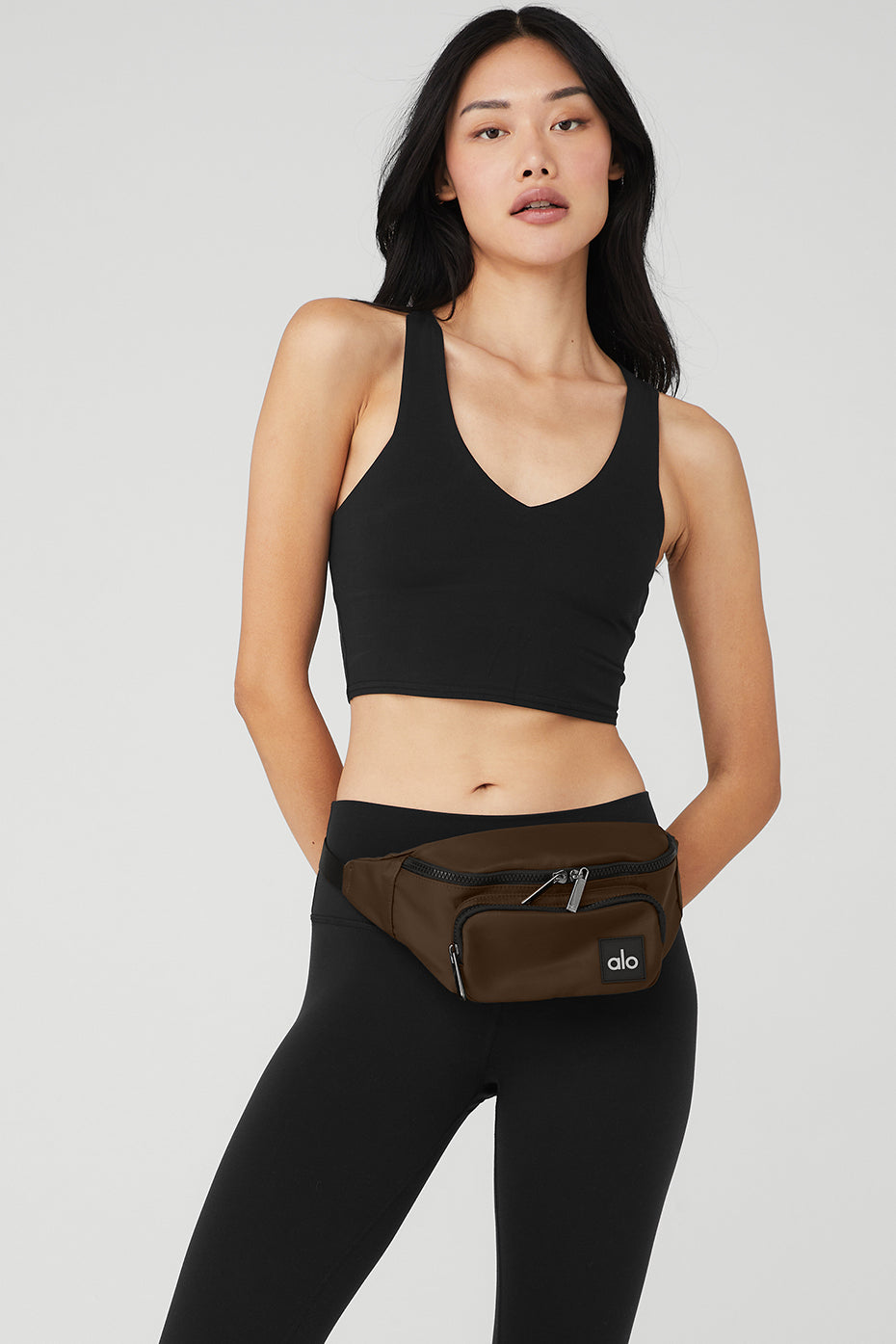 Explorer travel pouch in espresso, showing exterior zip pockets for easy access.
