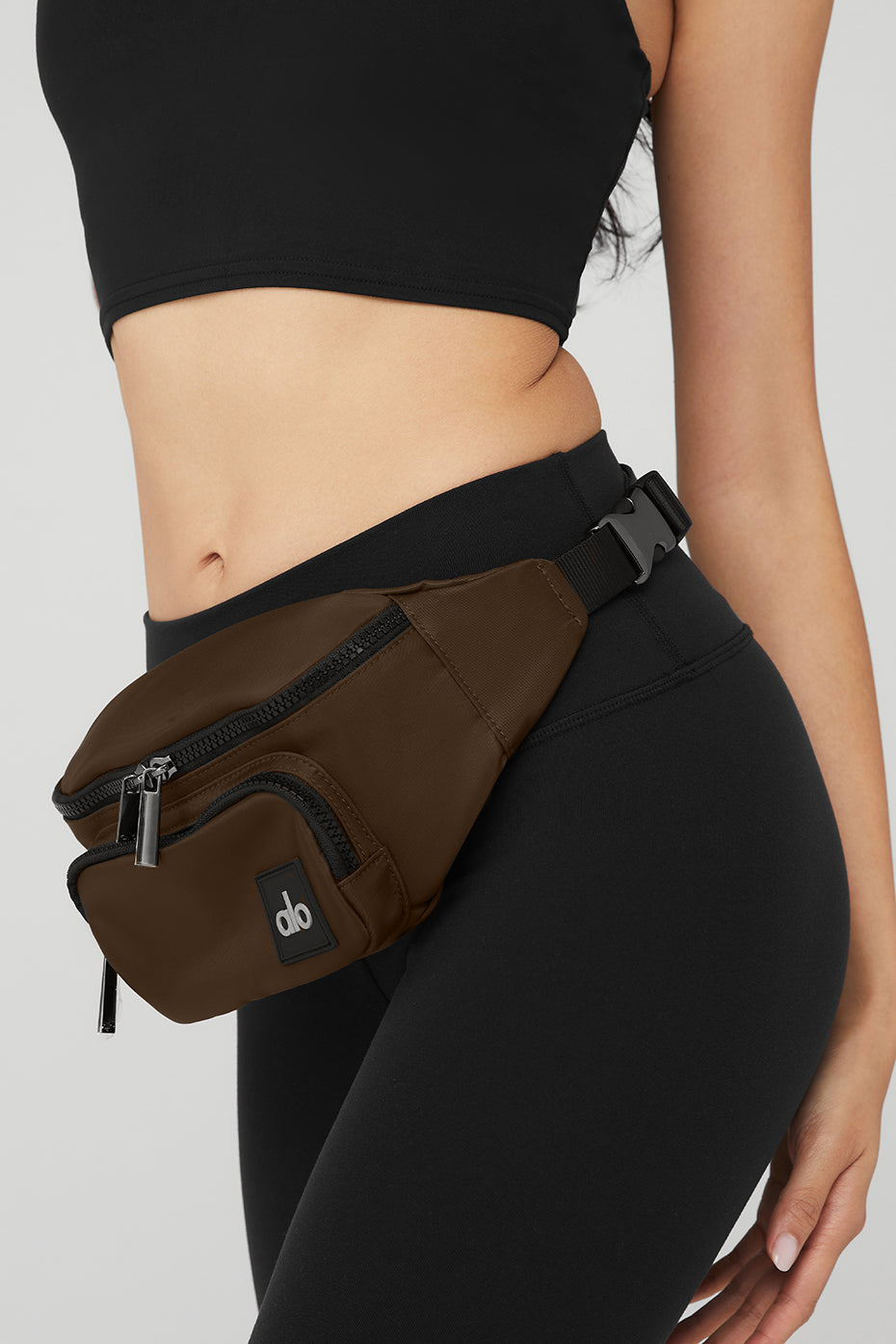 Detail of the adjustable strap on the Explorer waist bag, perfect for hands-free travel.
