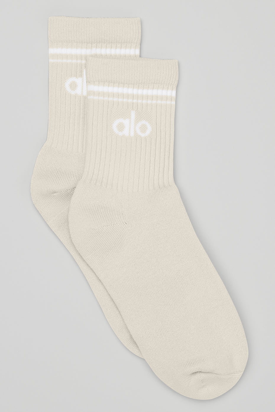 Retro crew socks on hardwood floor, styled with vintage sneakers